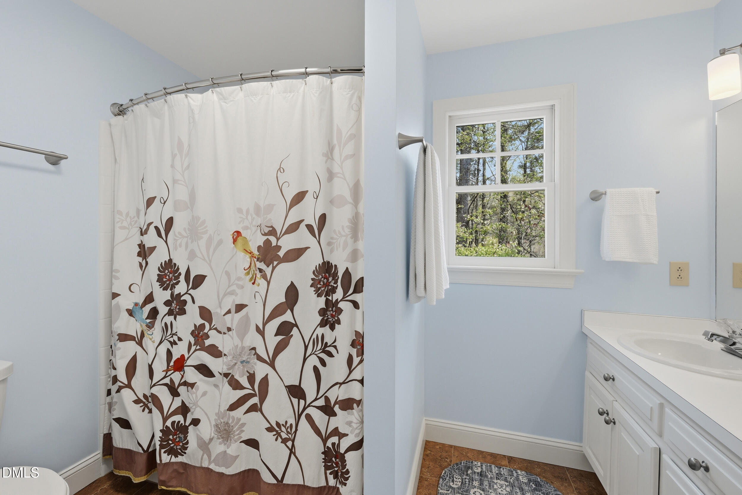 4001 Stemmons Court Raleigh, NC 27613 - Photo 25 of 45 a bathroom with a sink and a mirror
