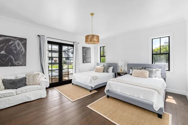 a bedroom with bed and window