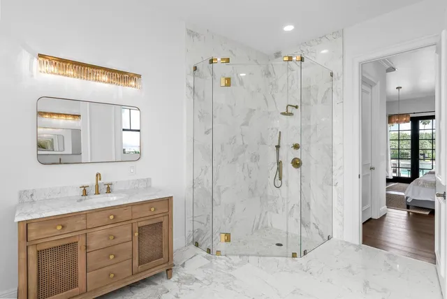 a bedroom with two beds and a large window