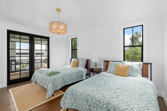 a bathroom with a granite countertop double vanity sink and a mirror