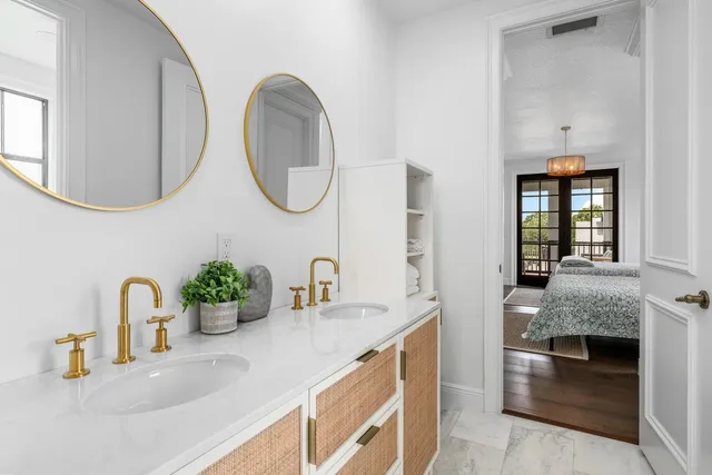 a view of a hallway with wooden floor and windows