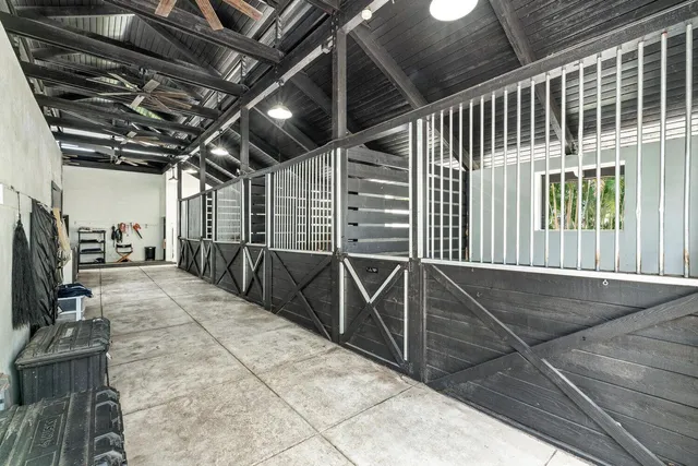 a view of an house with backyard space and balcony