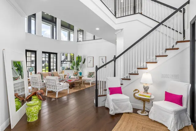 a living room with furniture and a potted plant