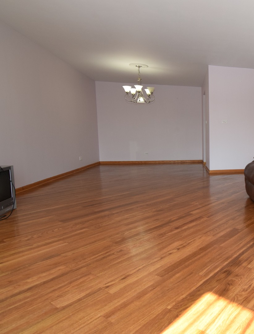 2400 Archbury Lane, Unit 2H Park Ridge, IL 60068 - Photo 11 of 26 a view of empty room with wooden floor