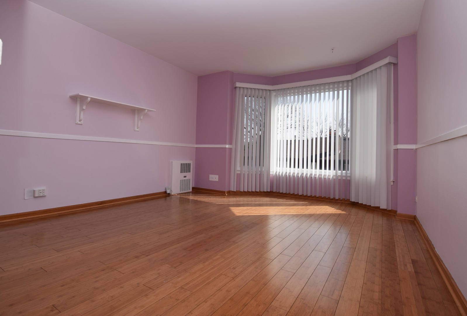 2400 Archbury Lane, Unit 2H Park Ridge, IL 60068 - Photo 6 of 26 wooden floor in an empty room with a window