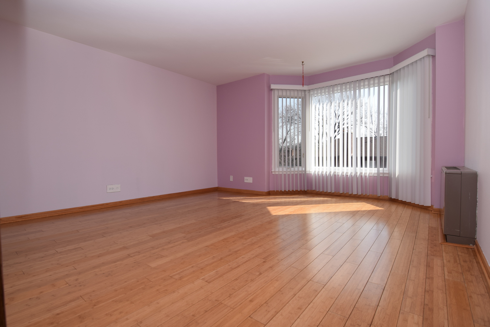 2400 Archbury Lane, Unit 2H Park Ridge, IL 60068 - Photo 7 of 26 a view of empty room with wooden floor and fan