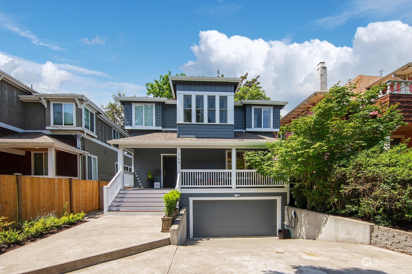 319 18th Avenue Seattle, WA 98122 - Photo 1 of 38 a view of a house with a garden and pathway