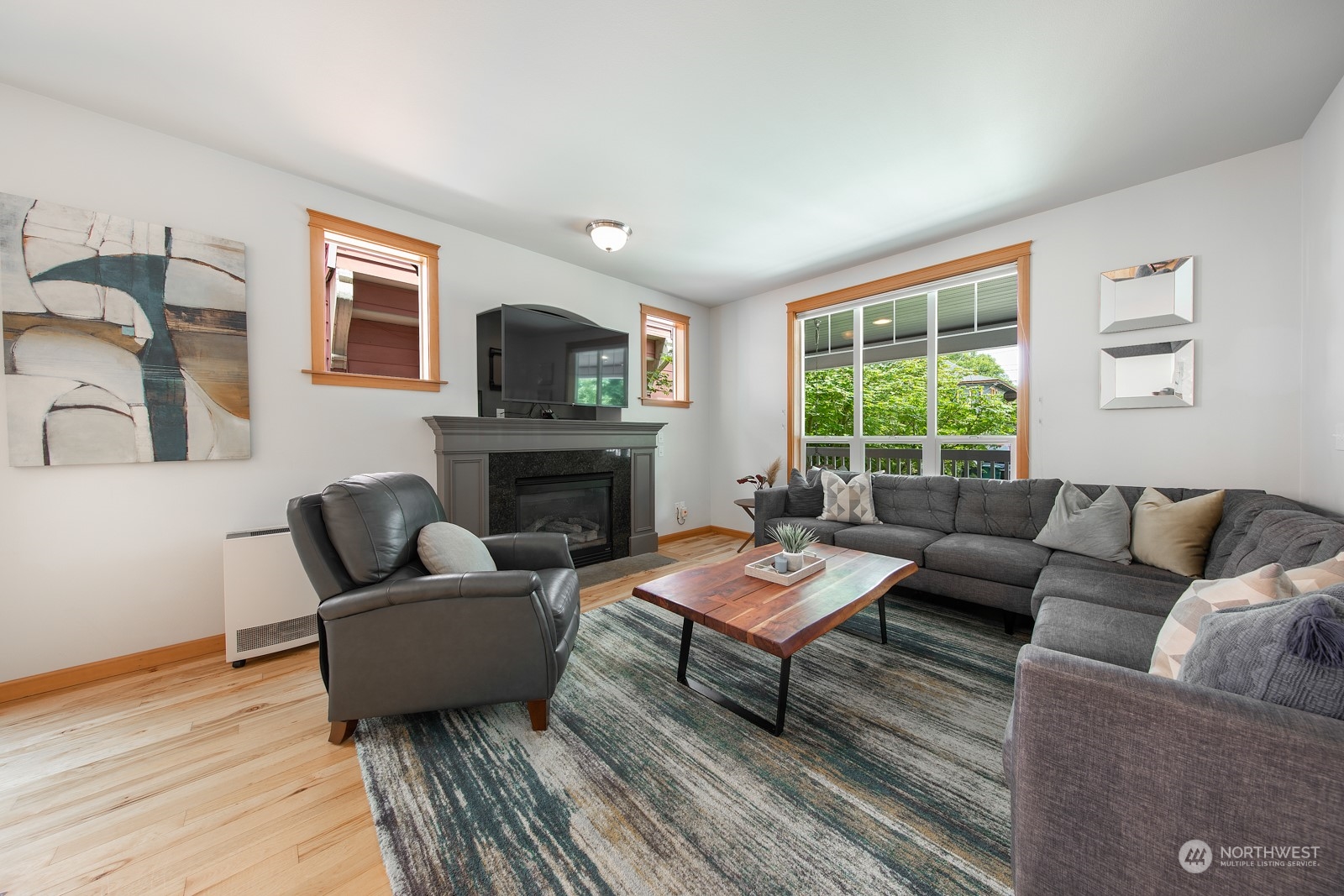 319 18th Avenue Seattle, WA 98122 - Photo 12 of 38 a living room with furniture a fireplace and a window