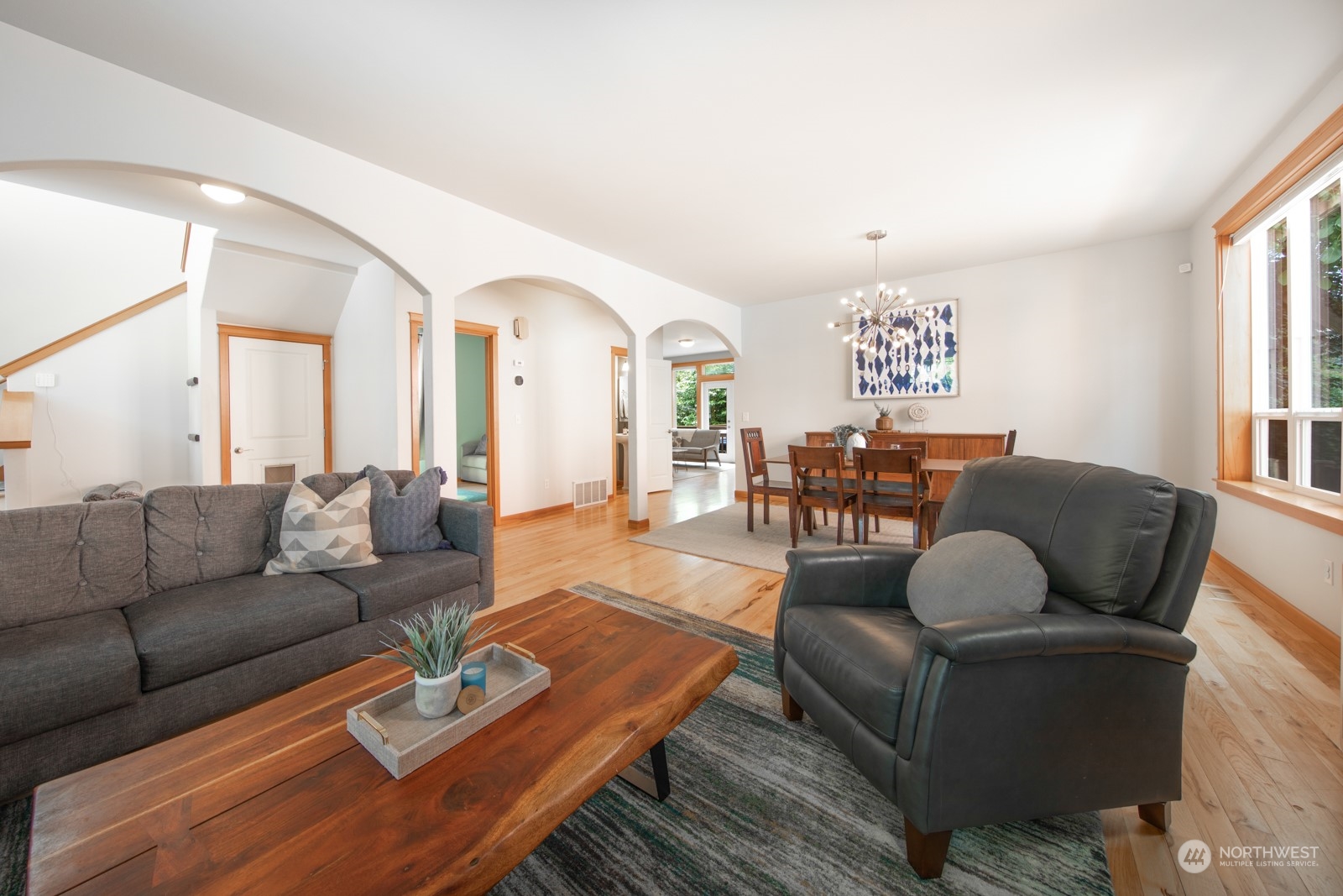 319 18th Avenue Seattle, WA 98122 - Photo 13 of 38 a living room with furniture wooden floor and a large window