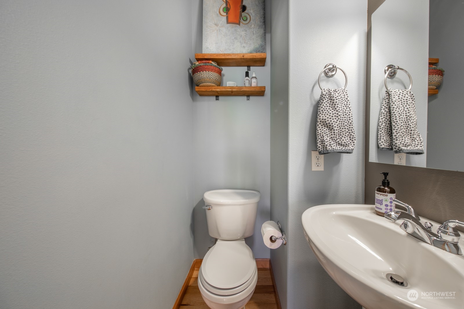 319 18th Avenue Seattle, WA 98122 - Photo 14 of 38 a bathroom with a toilet sink and mirror