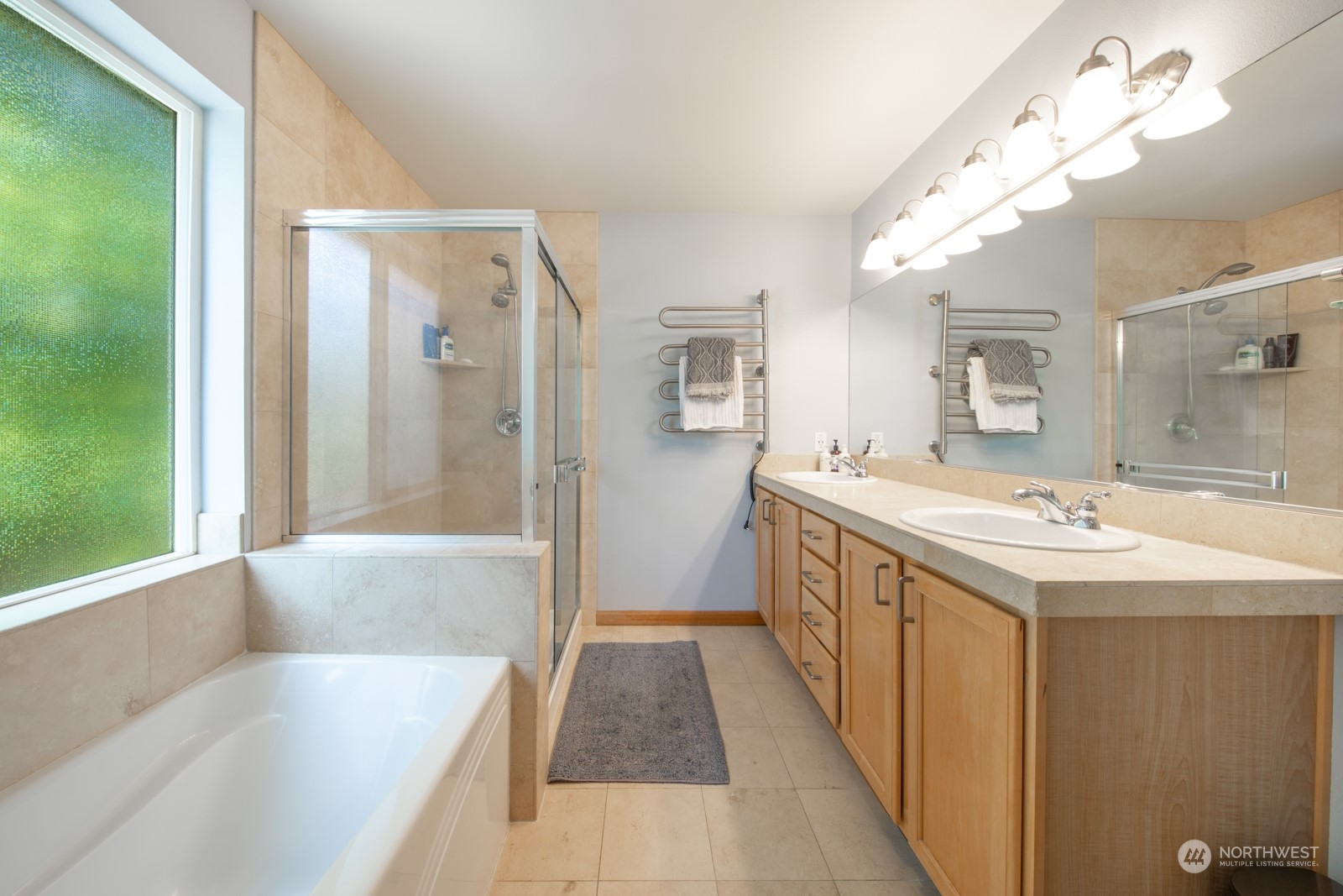 319 18th Avenue Seattle, WA 98122 - Photo 17 of 38 a bathroom with a tub sink and mirror