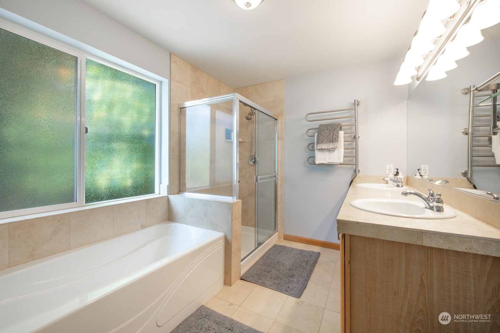 319 18th Avenue Seattle, WA 98122 - Photo 18 of 38 a bathroom with a tub sink and mirror