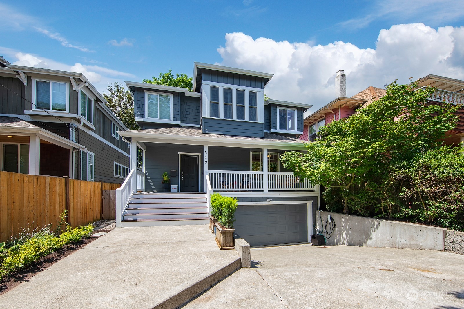 319 18th Avenue Seattle, WA 98122 - Photo 2 of 38 a front view of a house with a garden