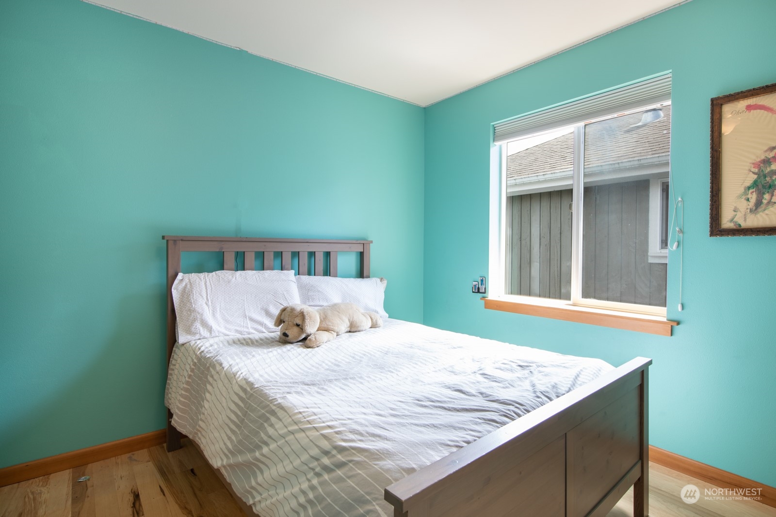 319 18th Avenue Seattle, WA 98122 - Photo 23 of 38 a bed sitting in a bedroom next to a window
