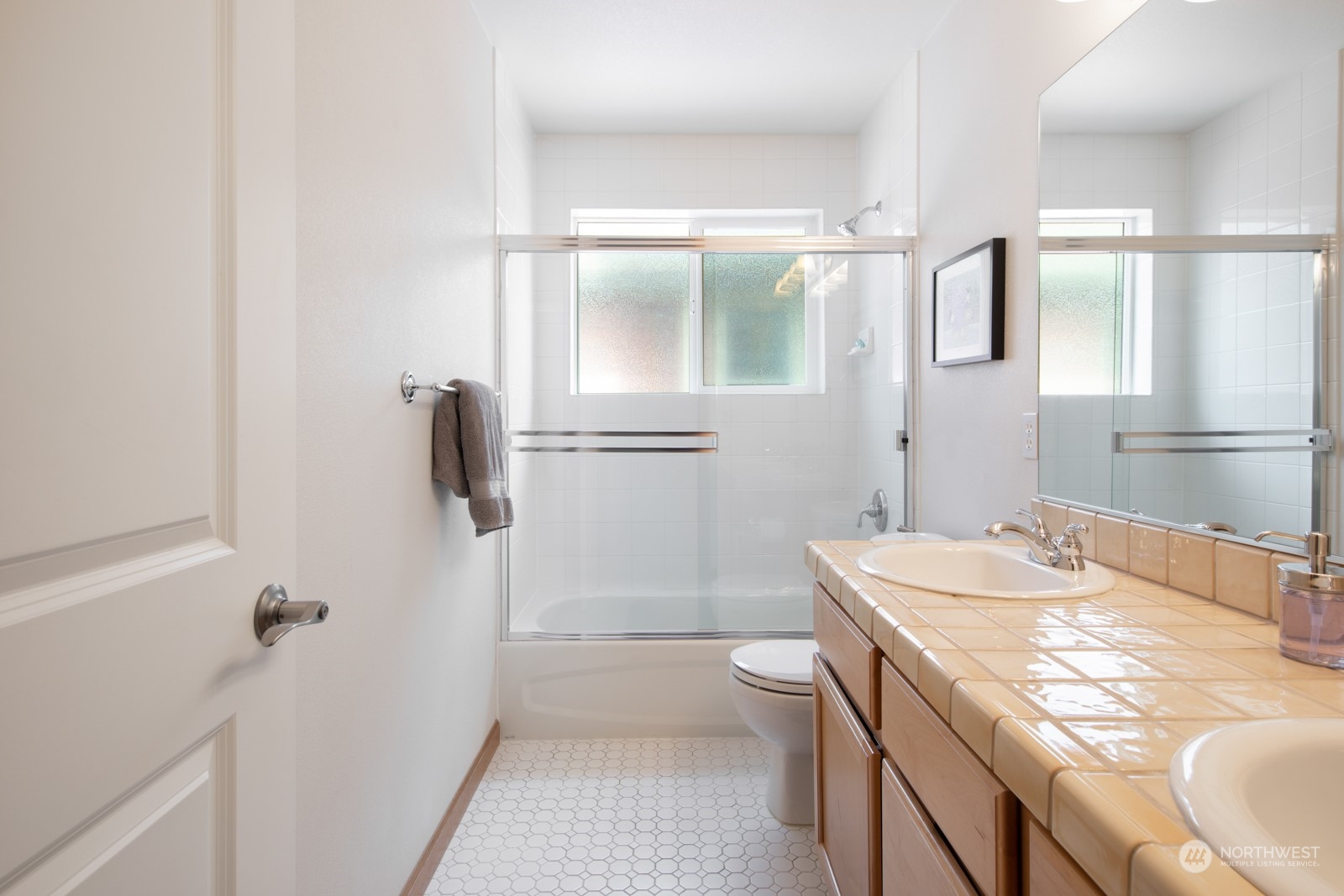 319 18th Avenue Seattle, WA 98122 - Photo 24 of 38 a bathroom with a sink a toilet and shower