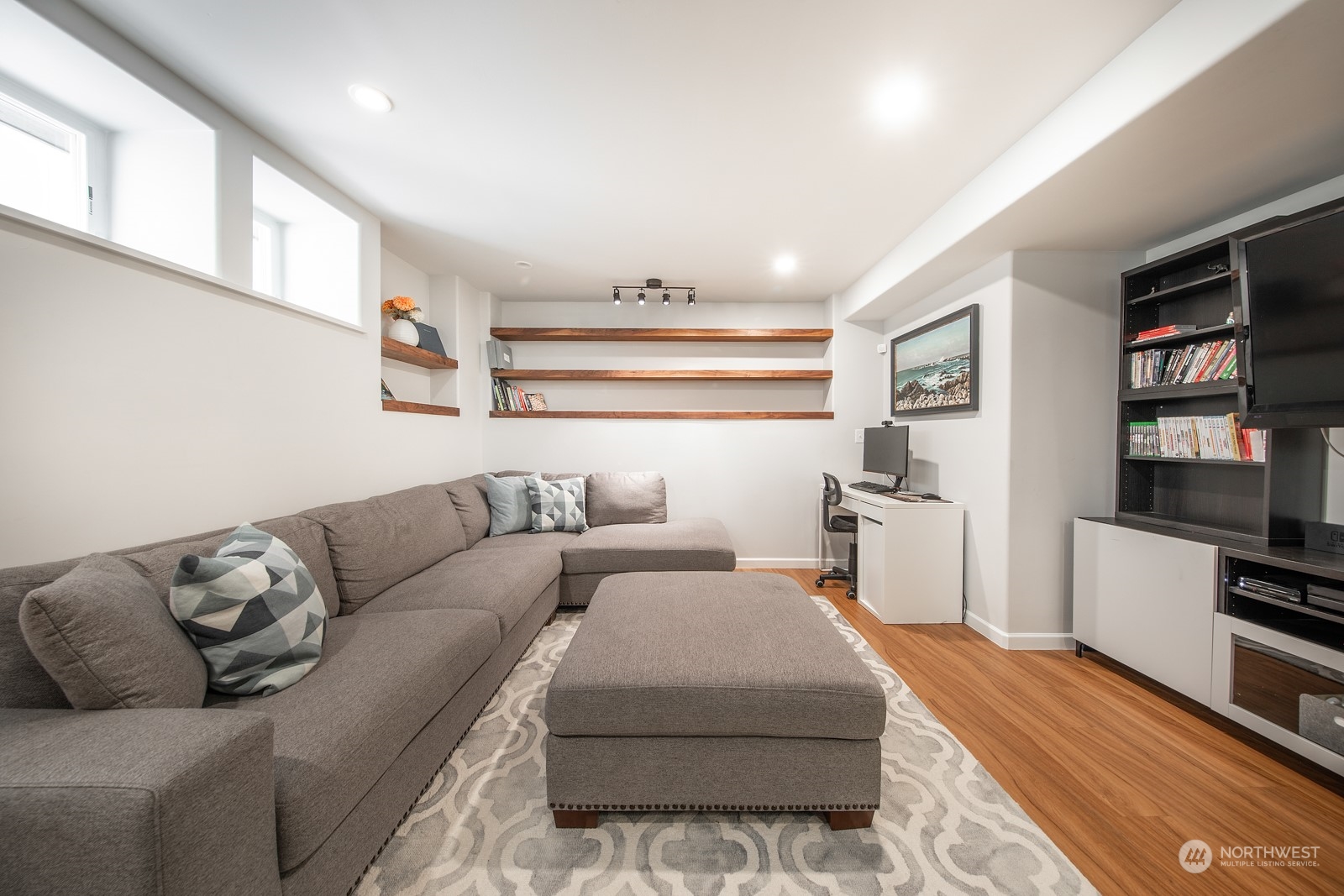 319 18th Avenue Seattle, WA 98122 - Photo 25 of 38 a living room with furniture and a flat screen tv