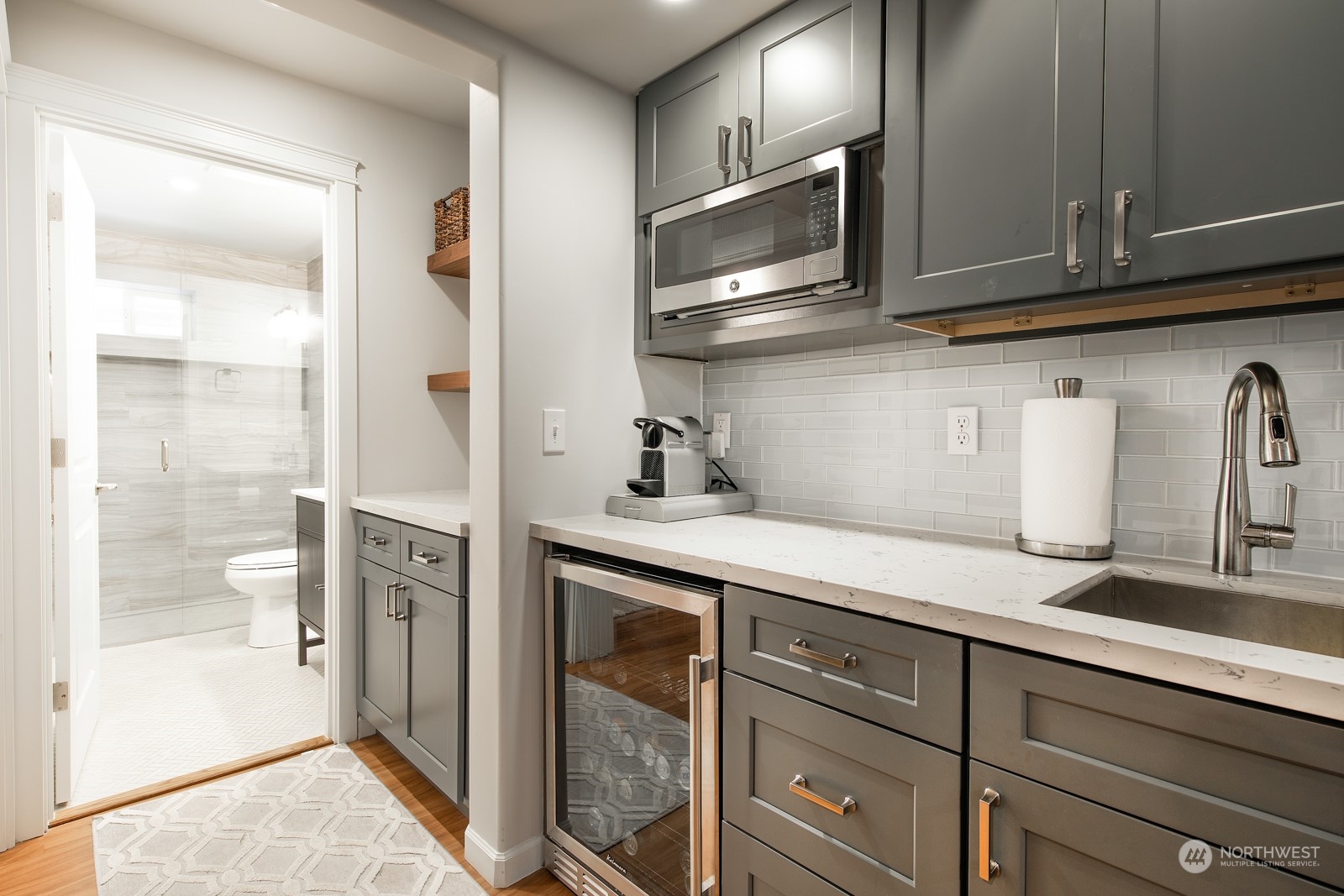 319 18th Avenue Seattle, WA 98122 - Photo 27 of 38 a kitchen with stainless steel appliances granite countertop a sink and a refrigerator