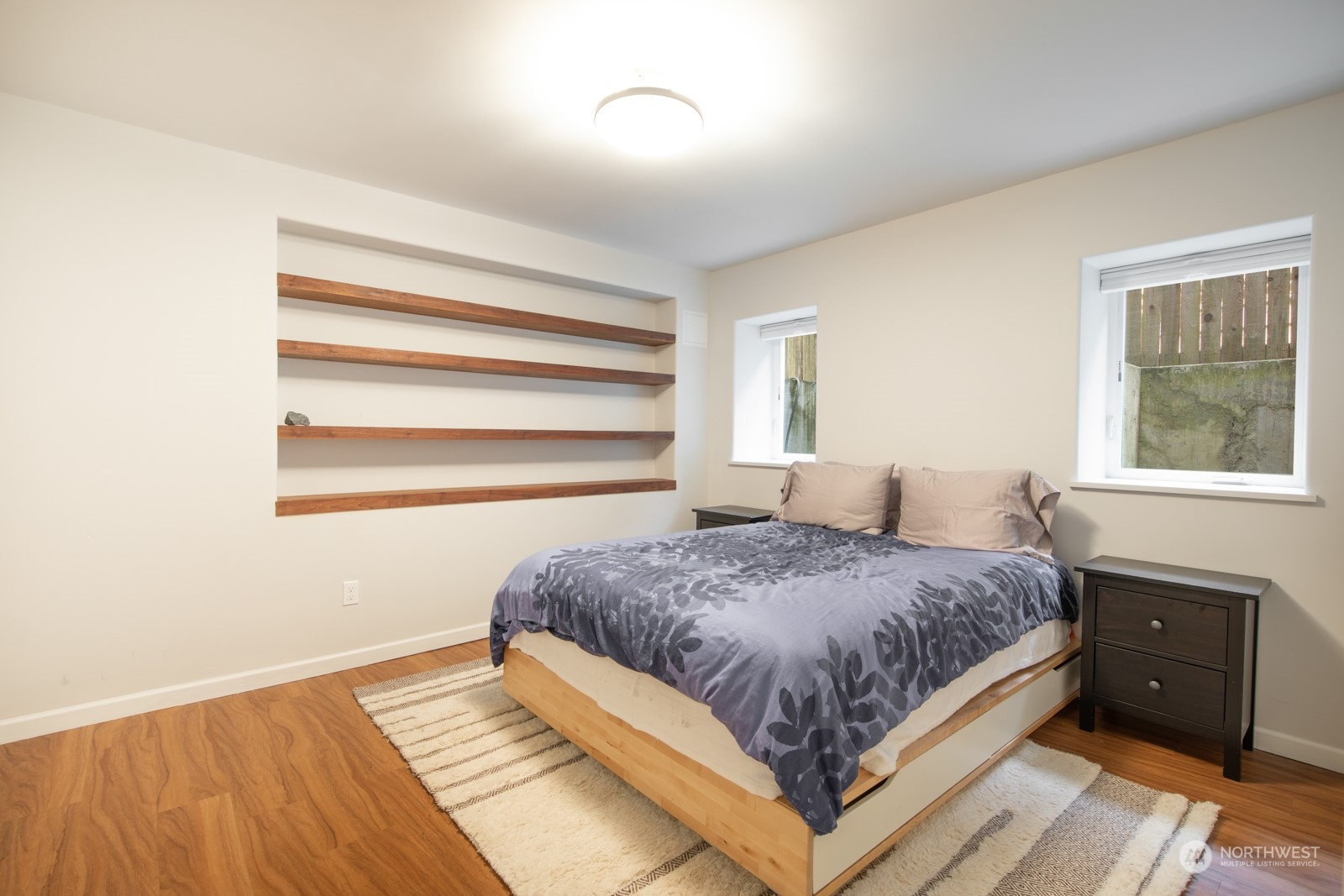 319 18th Avenue Seattle, WA 98122 - Photo 28 of 38 a bedroom with a bed and a window
