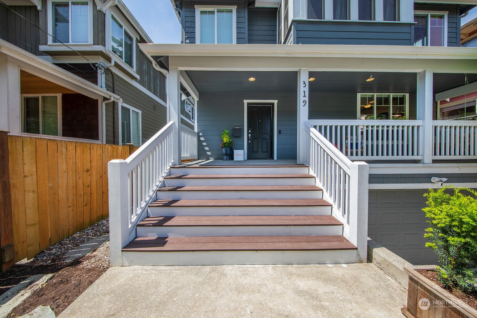 319 18th Avenue Seattle, WA 98122 - Photo 3 of 38 a view of a house with large windows and stairs