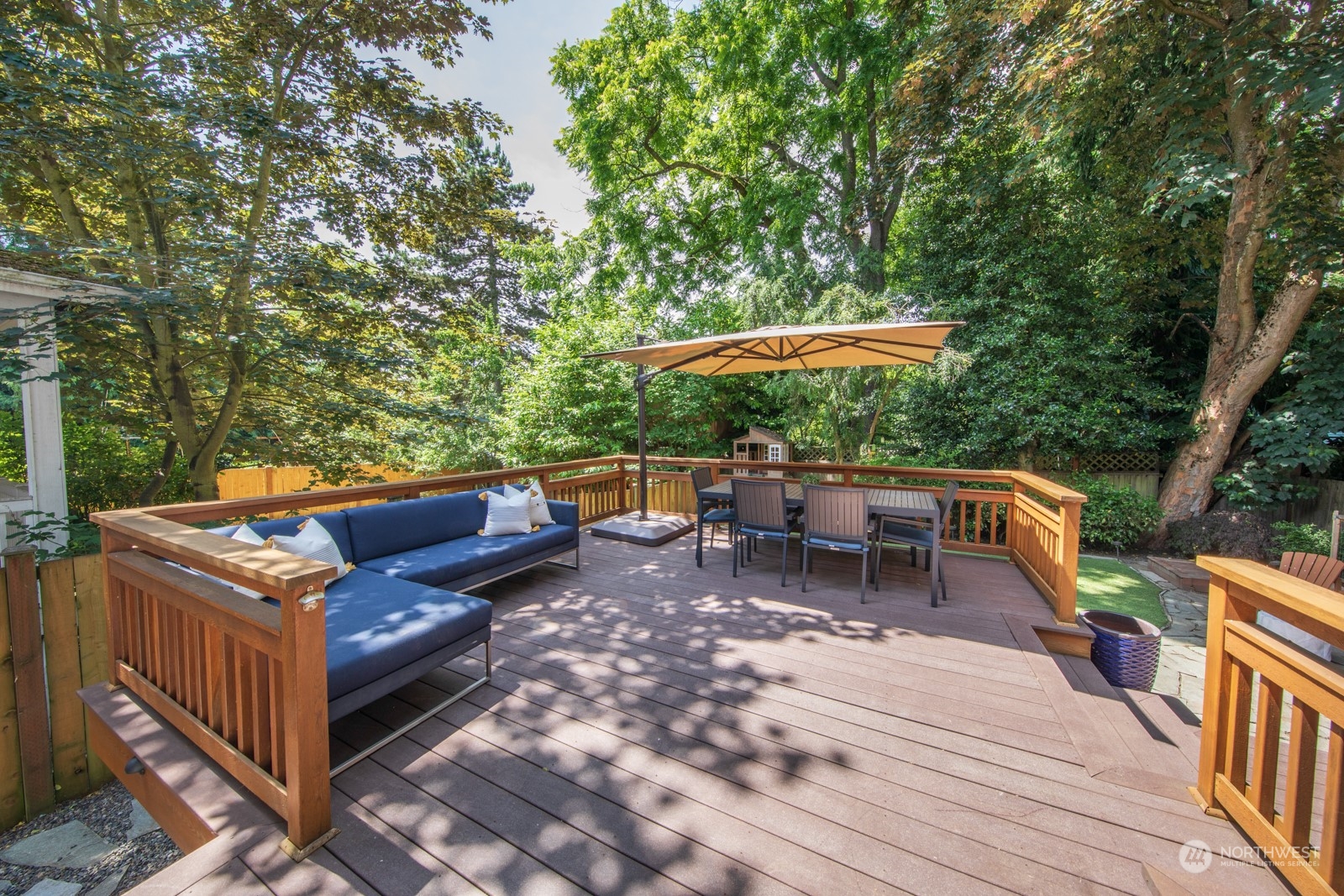 319 18th Avenue Seattle, WA 98122 - Photo 33 of 38 an outdoor sitting area with furniture and wooden deck