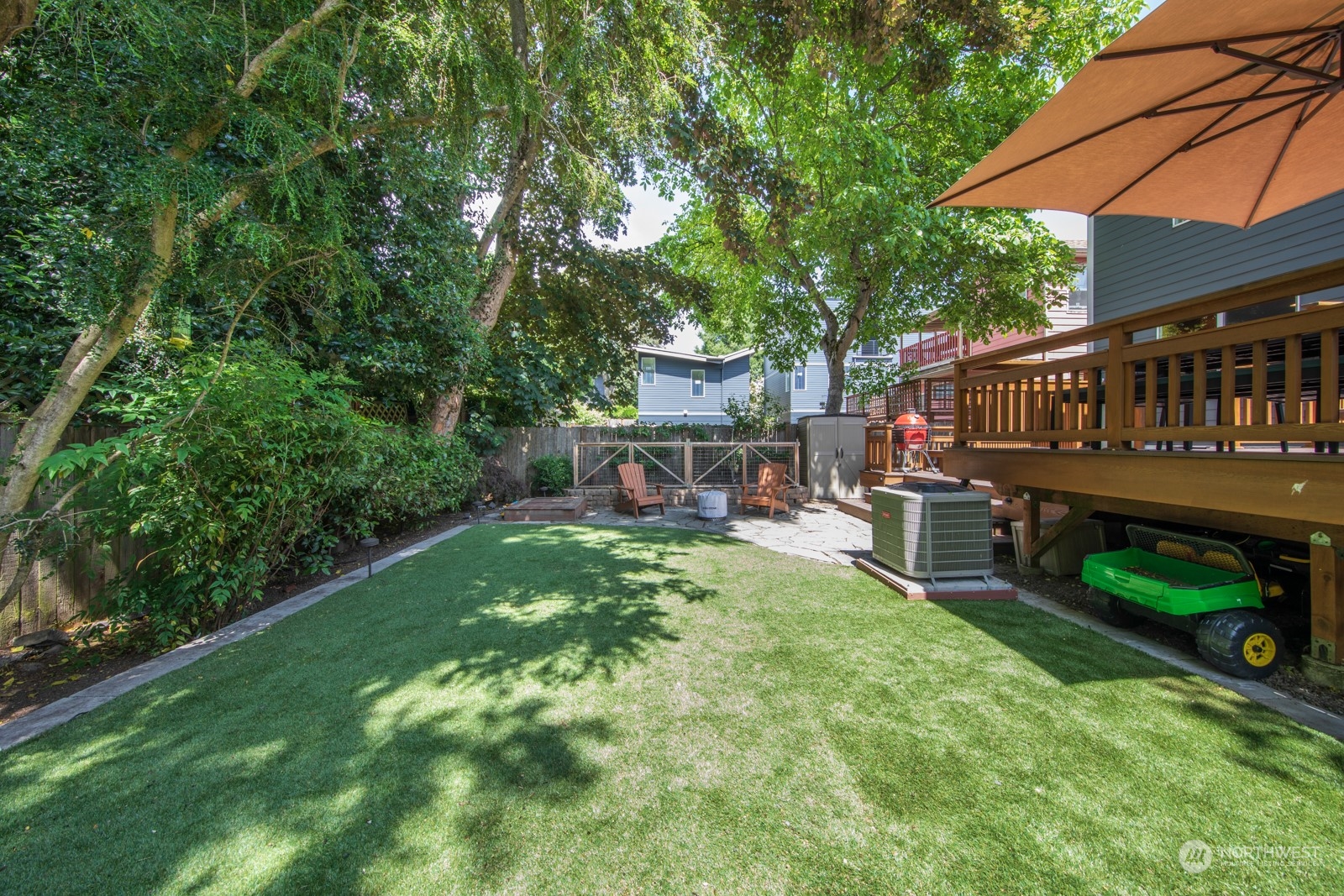 319 18th Avenue Seattle, WA 98122 - Photo 35 of 38 a view of a chair and table in backyard of the house
