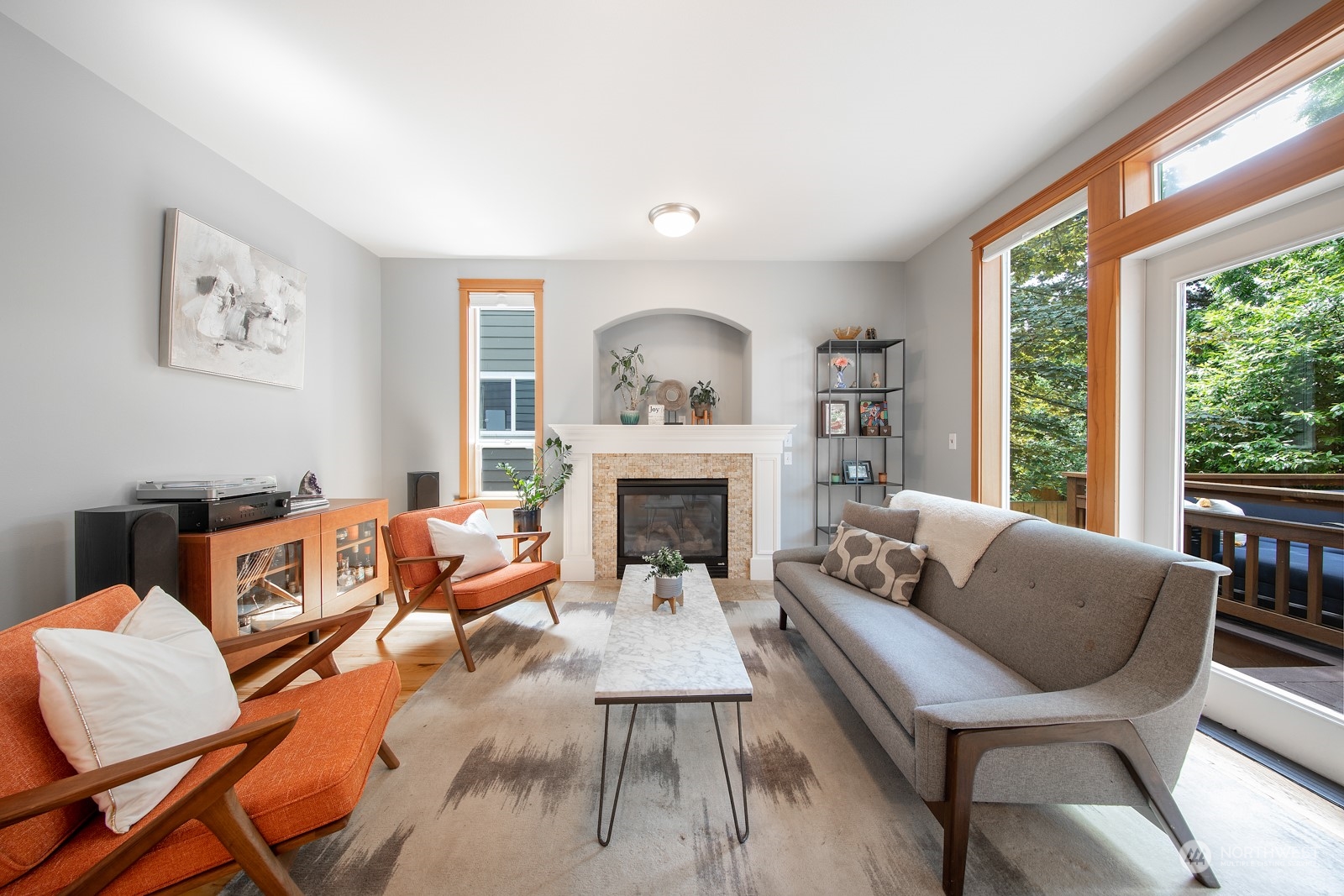 319 18th Avenue Seattle, WA 98122 - Photo 6 of 38 a living room with furniture a fireplace and a large window
