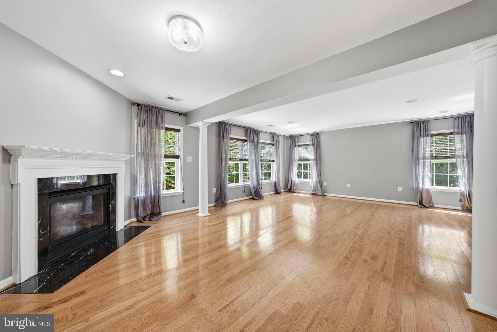 3679 Expedition Drive Triangle, VA 22172 - Photo 28 of 65 a view of an empty room with wooden floor fireplace and a window