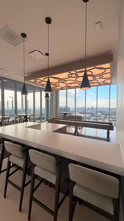 a kitchen with a table and chairs