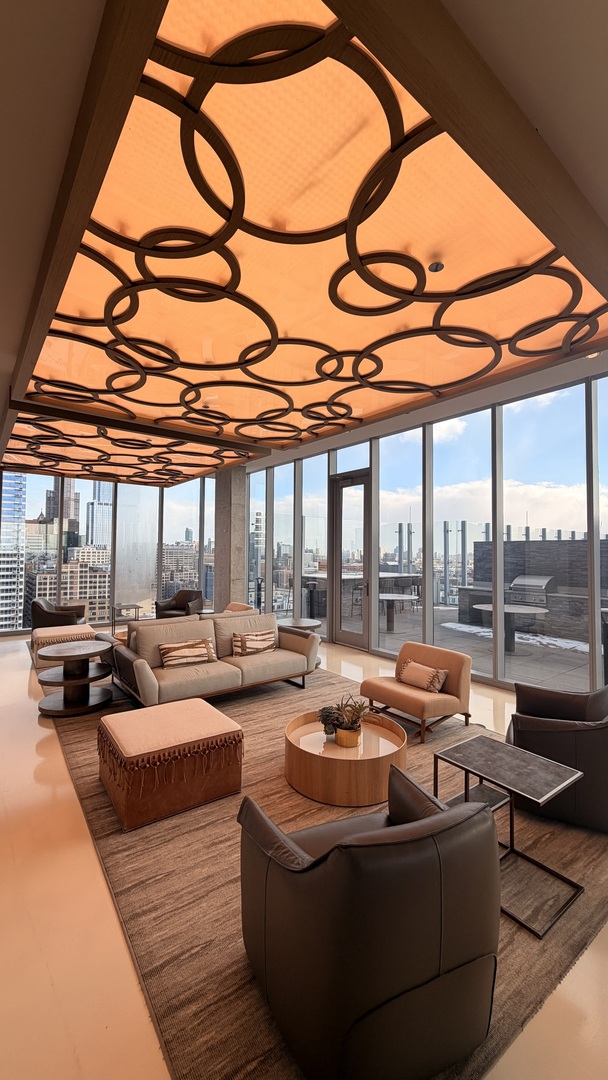 205 South Peoria Street, Unit 1515 Chicago, IL 60607 - Photo 3 of 17 a outdoor space with patio couches and a fireplace