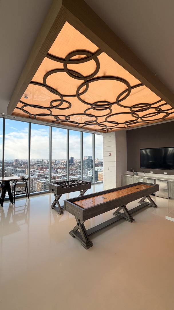 205 South Peoria Street, Unit 1515 Chicago, IL 60607 - Photo 4 of 17 a building with pool table and chairs