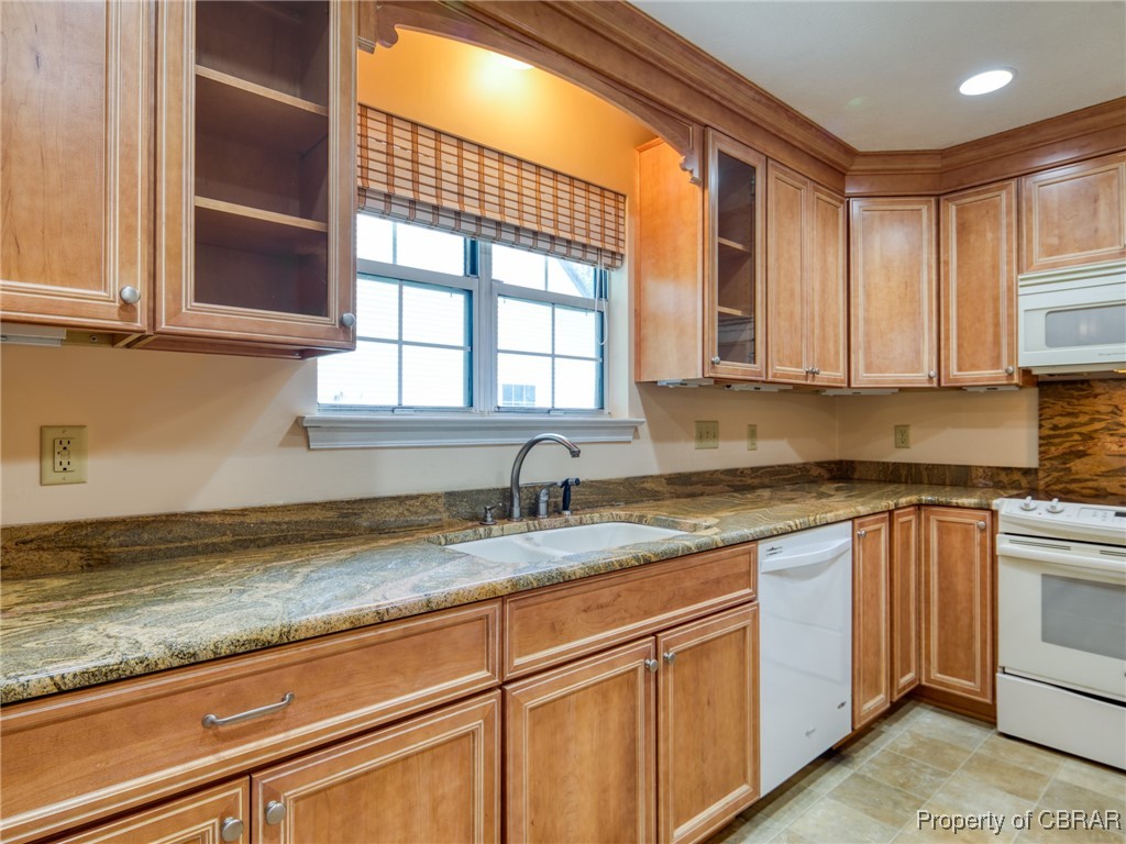 6 Ruth Circle Hampton, VA 23666 - Photo 15 of 50 Kitchen featuring white appliances, sink, dark stone counters, and light tile patterned floors