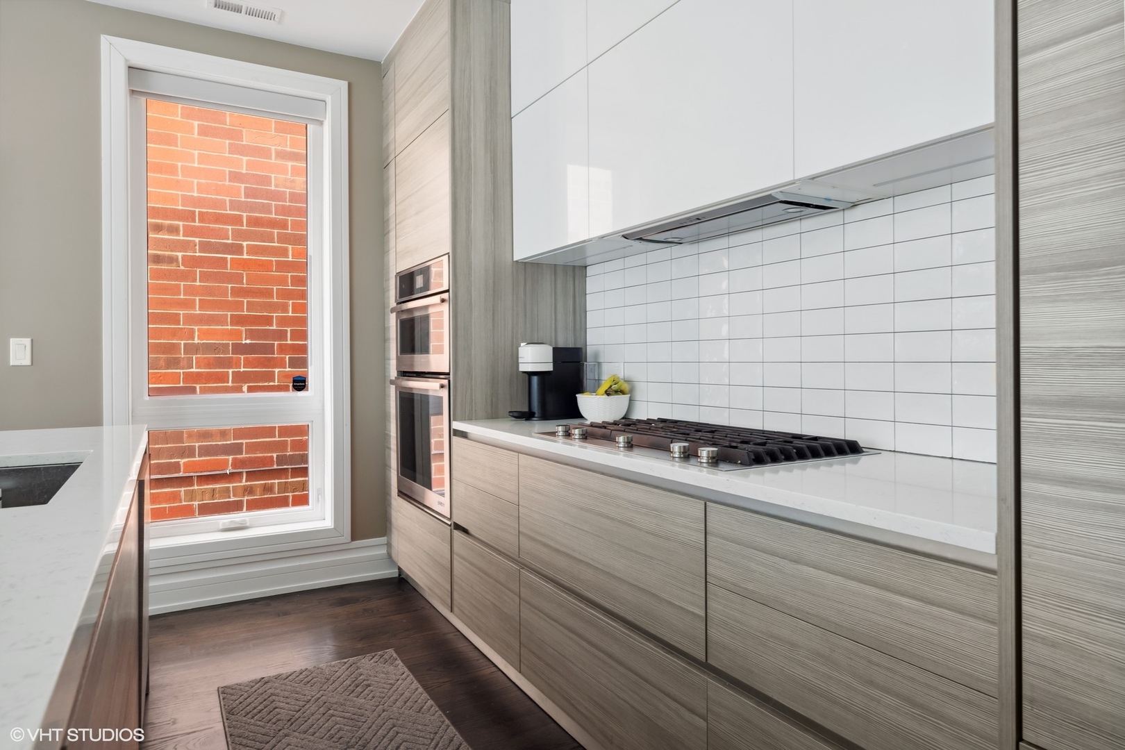 1448 West Chestnut Street, Unit 2 Chicago, IL 60642 - Photo 11 of 20 a kitchen with a stove and a window