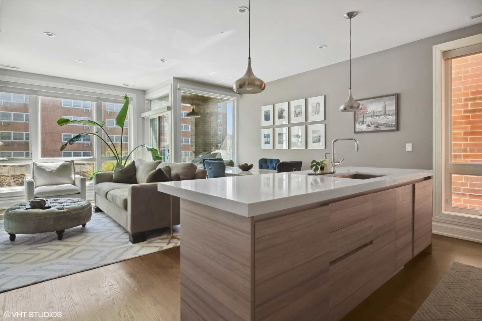 1448 West Chestnut Street, Unit 2 Chicago, IL 60642 - Photo 12 of 20 a living room with furniture and a chandelier