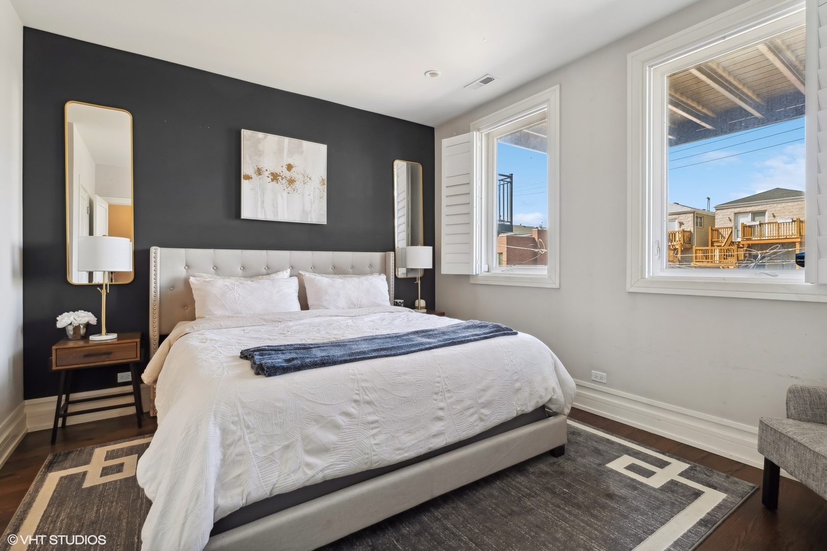 1448 West Chestnut Street, Unit 2 Chicago, IL 60642 - Photo 13 of 20 a bedroom with a bed and a window