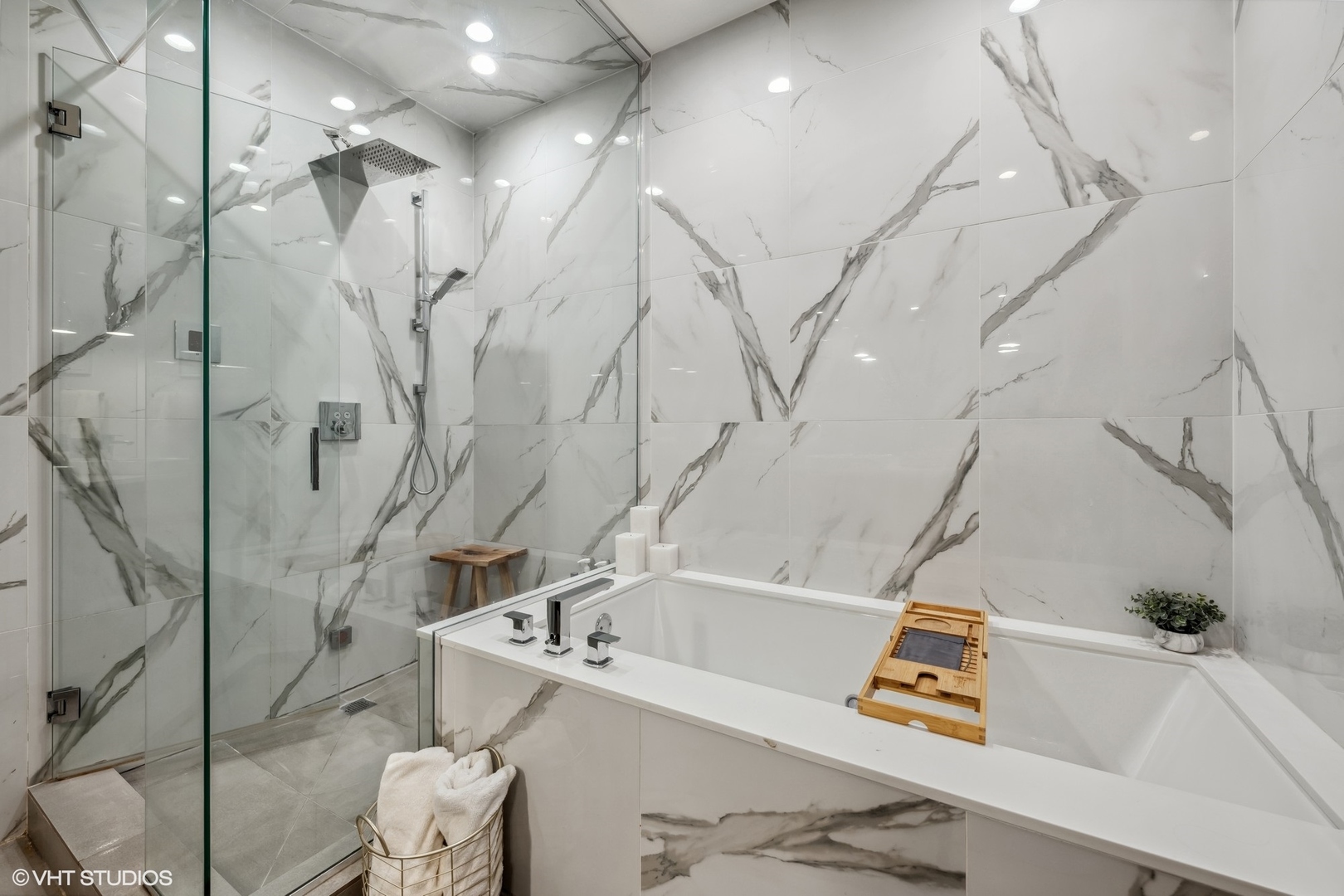 1448 West Chestnut Street, Unit 2 Chicago, IL 60642 - Photo 16 of 20 a bath tub sitting next to a white sink and vanity