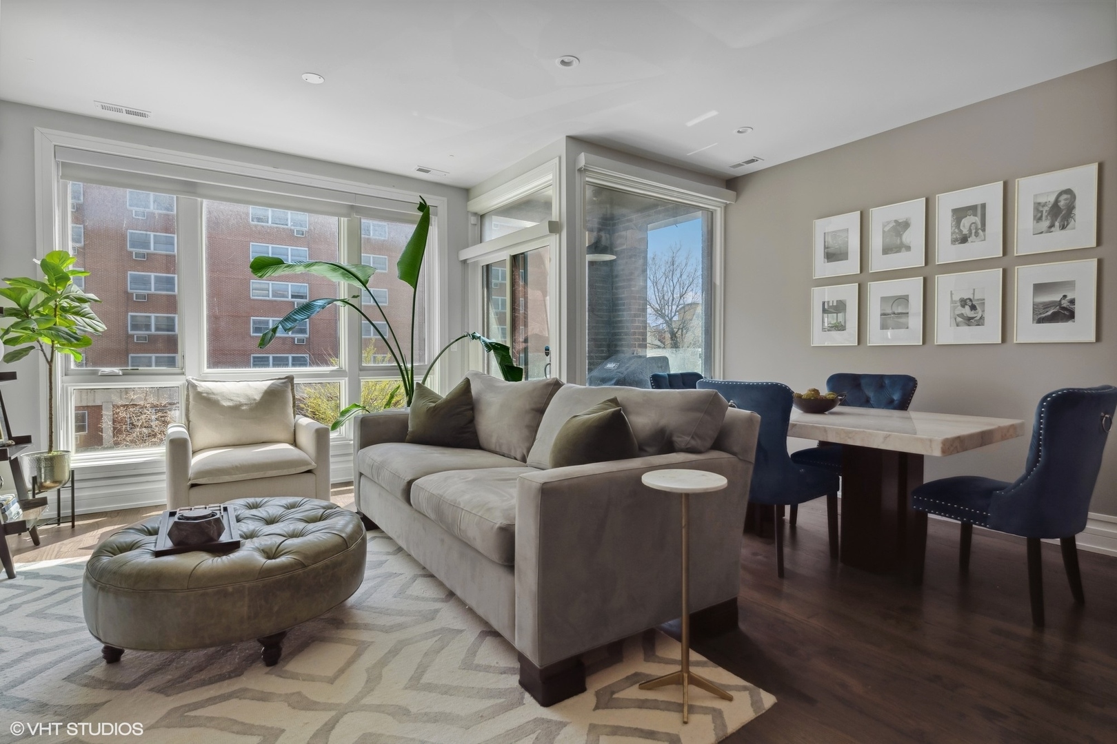 1448 West Chestnut Street, Unit 2 Chicago, IL 60642 - Photo 2 of 20 a living room with furniture and wooden floor