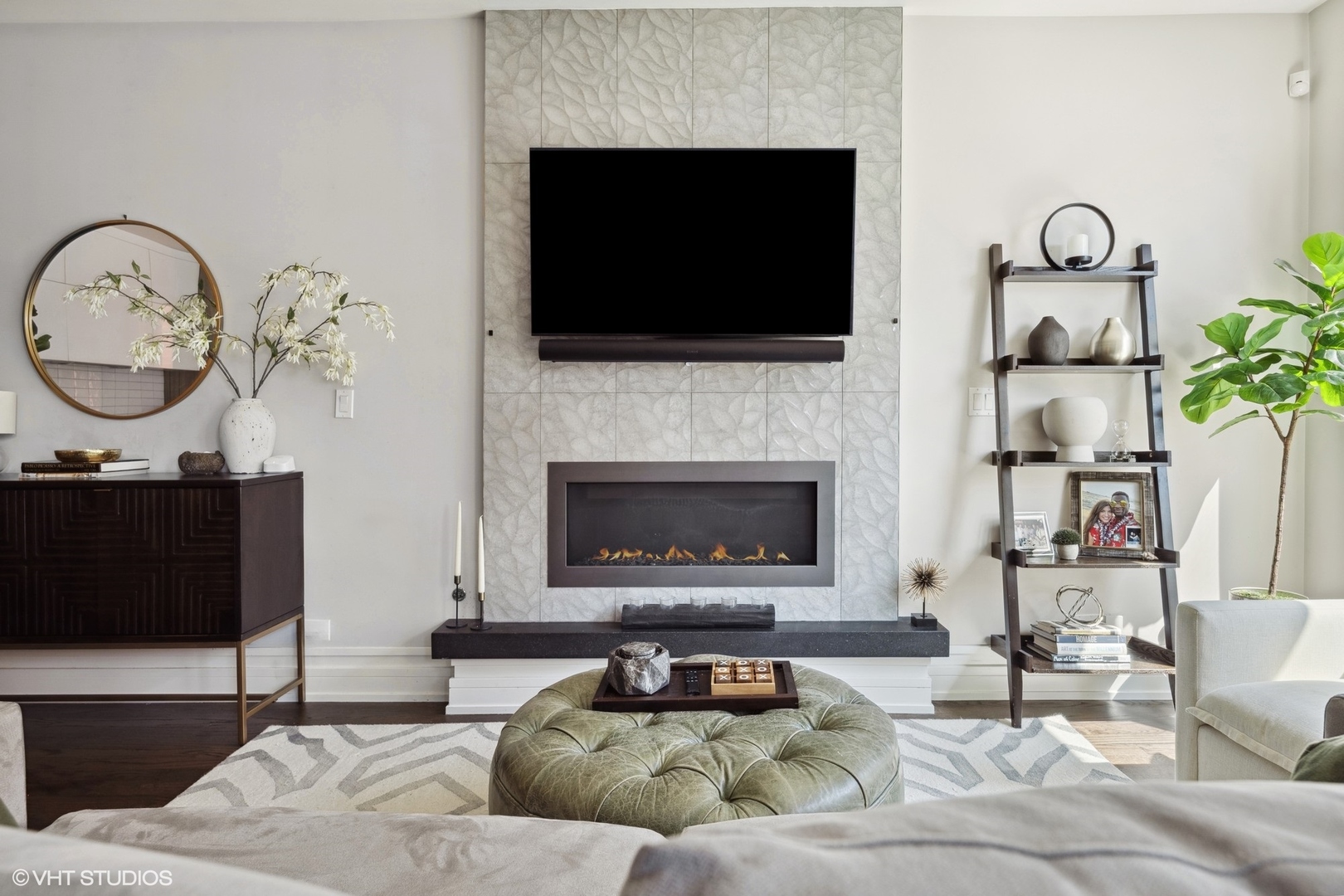 1448 West Chestnut Street, Unit 2 Chicago, IL 60642 - Photo 3 of 20 a living room with furniture a flat screen tv and a fireplace