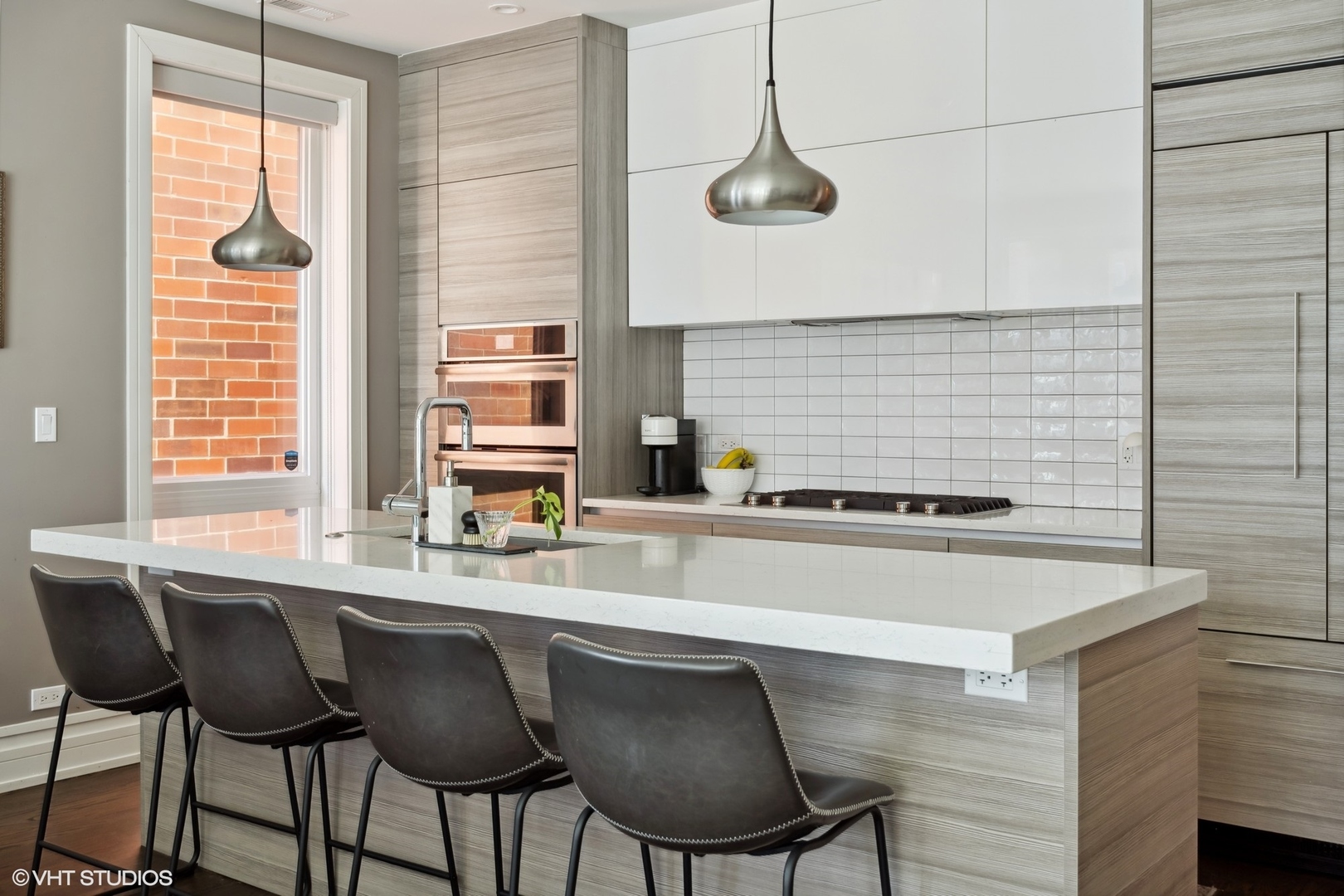 1448 West Chestnut Street, Unit 2 Chicago, IL 60642 - Photo 9 of 20 a kitchen with a table chairs a sink and dishwasher
