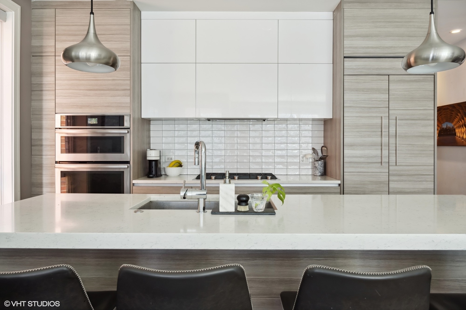 1448 West Chestnut Street, Unit 2 Chicago, IL 60642 - Photo 10 of 20 a kitchen with a table chairs and a refrigerator