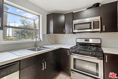 a kitchen with a stove and a microwave