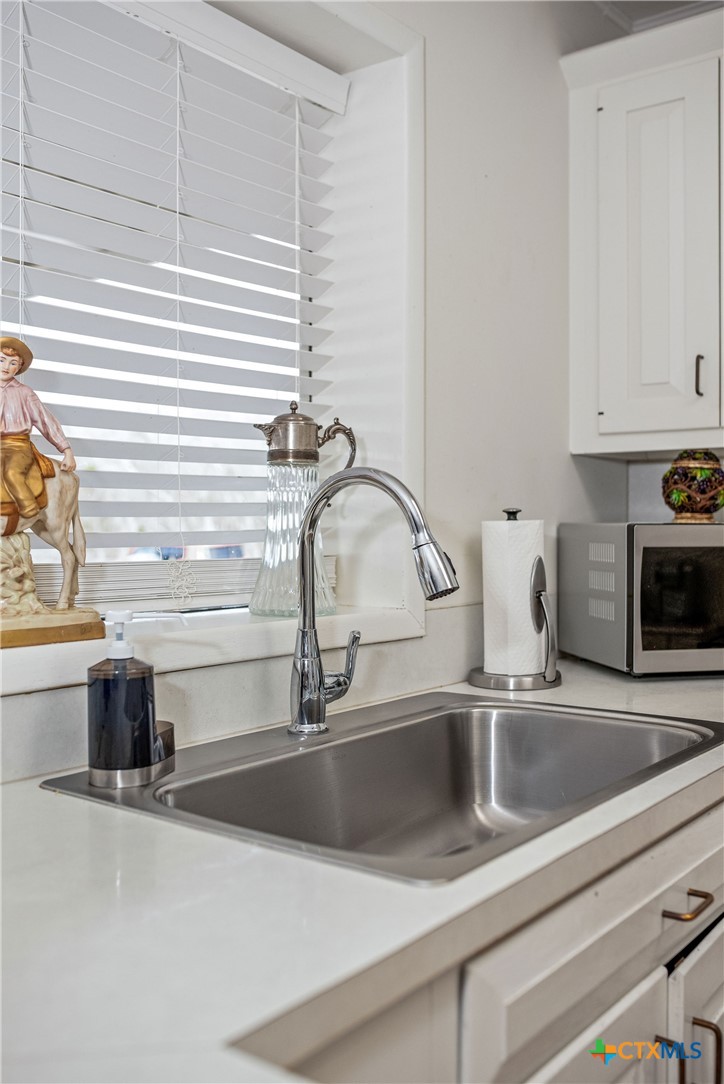 207 Williams Street Tivoli, TX 77990 - Photo 29 of 32 a kitchen with a sink and a window