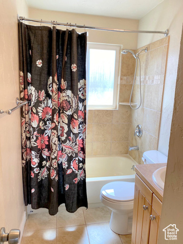 247 West 400 North, Unit 1 Moab, UT 84532 - Photo 19 of 27 Bathroom featuring shower / bath combo, vanity, and light tile patterned floors