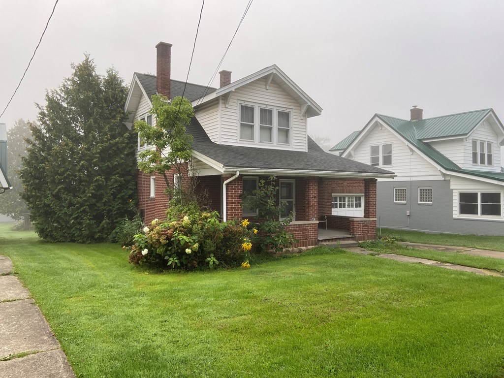 728 South Main Street Knox, PA 16232 - Photo 15 of 15 a front view of a house with a garden