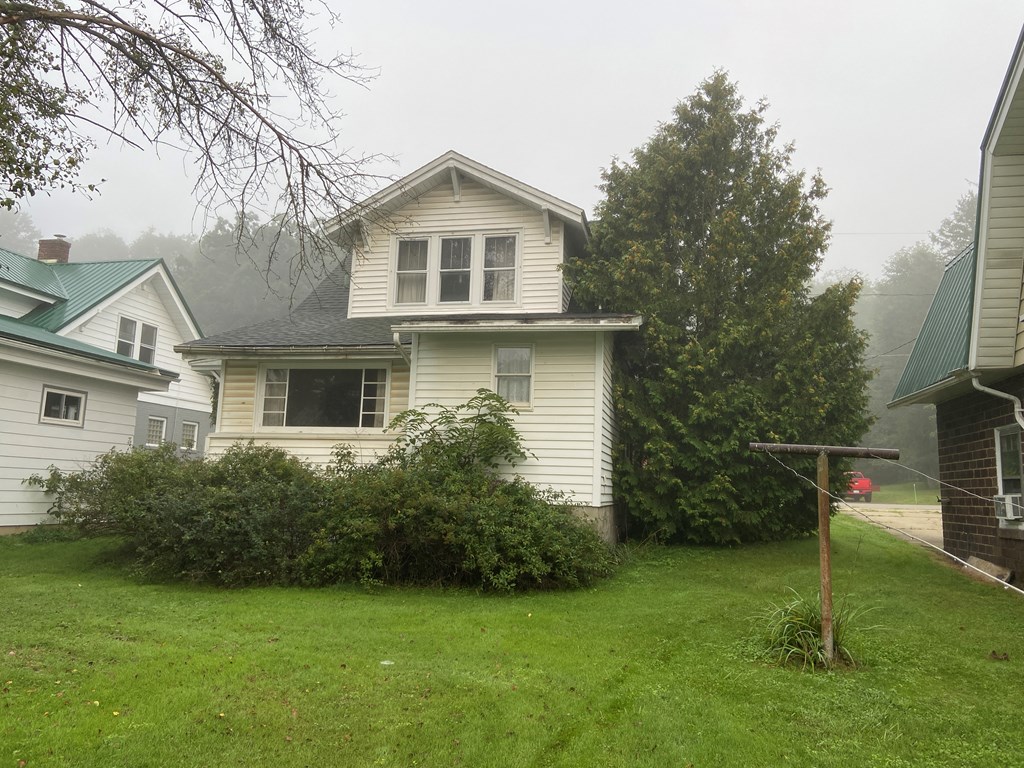 728 South Main Street Knox, PA 16232 - Photo 3 of 15 a front view of a house with garden
