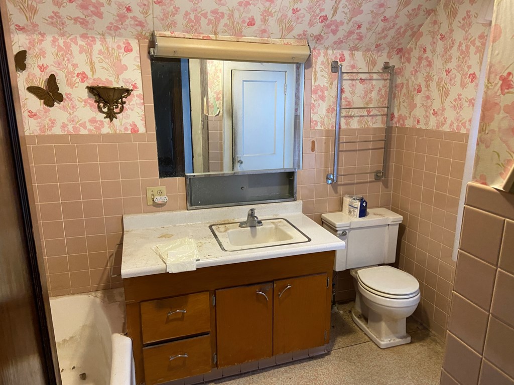 728 South Main Street Knox, PA 16232 - Photo 7 of 15 a bathroom with a sink a toilet and mirror