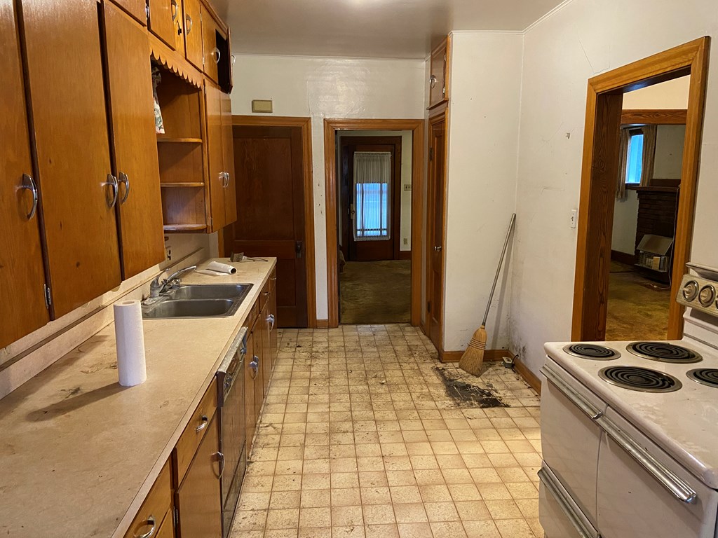 728 South Main Street Knox, PA 16232 - Photo 8 of 15 a kitchen with a stove and a refrigerator