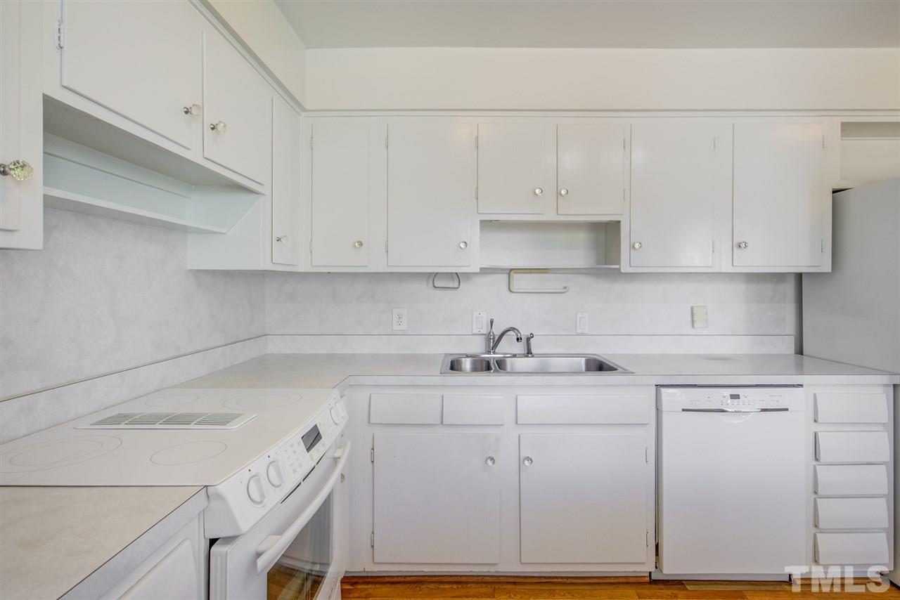 3424 Wade Avenue Raleigh, NC 27607 - Photo 11 of 30 a kitchen with a sink cabinets and appliances