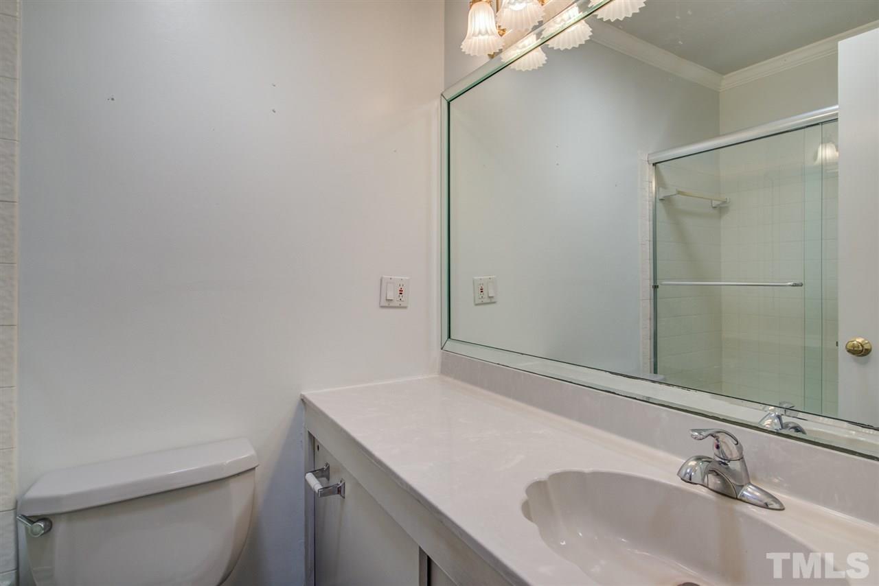 3424 Wade Avenue Raleigh, NC 27607 - Photo 14 of 30 a bathroom with a sink toilet and shower