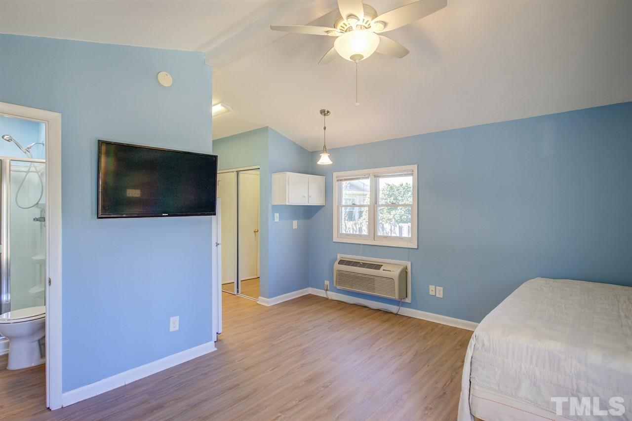 3424 Wade Avenue Raleigh, NC 27607 - Photo 22 of 30 a view of livingroom with hardwood floor and ceiling fan