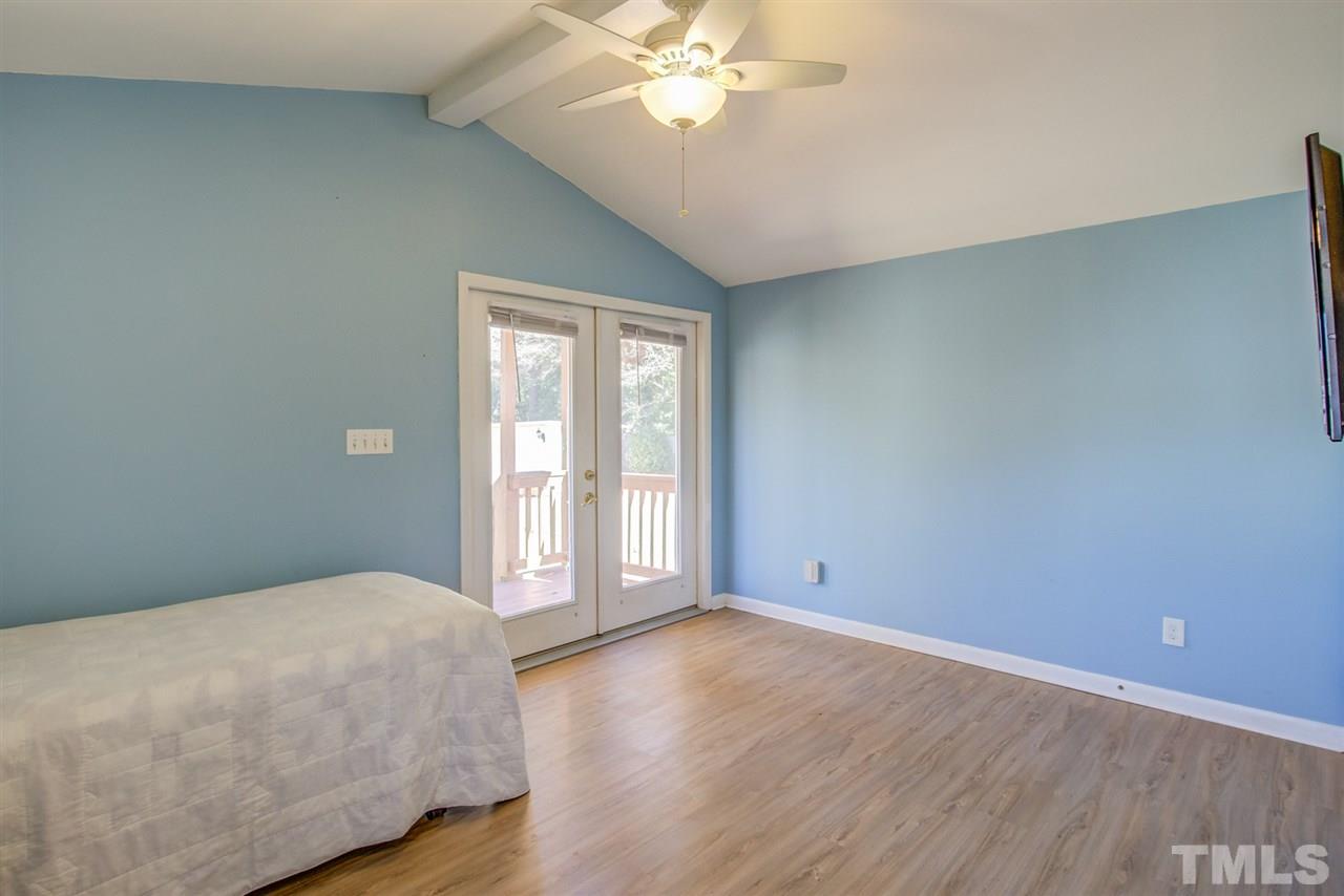 3424 Wade Avenue Raleigh, NC 27607 - Photo 23 of 30 a view of a big room with wooden floor and chandelier fan